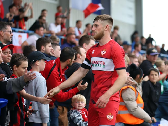 Captain Connor Kennedy shares a moment with the supporters after the Poppies fell just short in their play-off bid