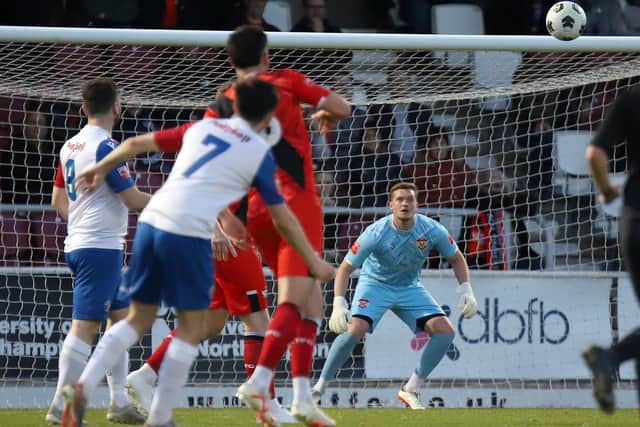 AFC Rushden & Diamonds' Ethan Johnston (no.7) tries his luck from distance (Picture: Peter Short)