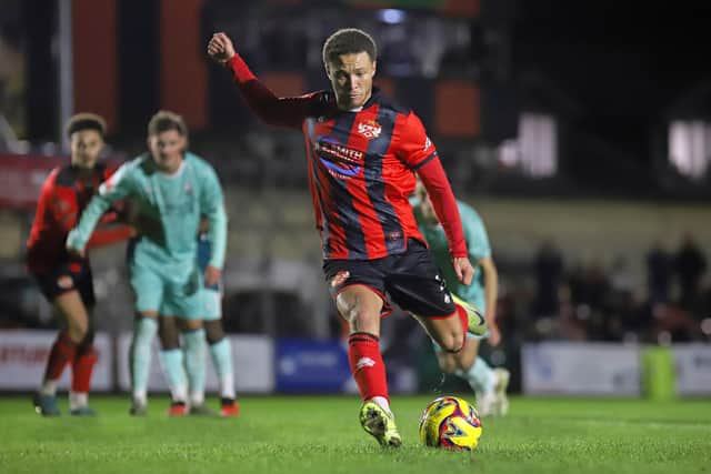 Jaiden White slots home Kettering's winning goal from the penalty spot (Picture: Peter Short)