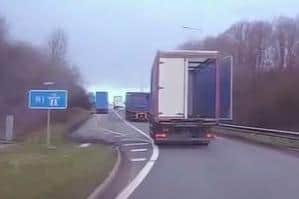 This lorry was caught on dashcam with its rear door open — shortly before heavy machinery tumbled out onto the M1 near Northampton