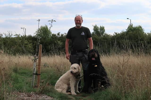 Park Ranger Mark Pomfrett with his dogs including his deputy Otto (on the right)