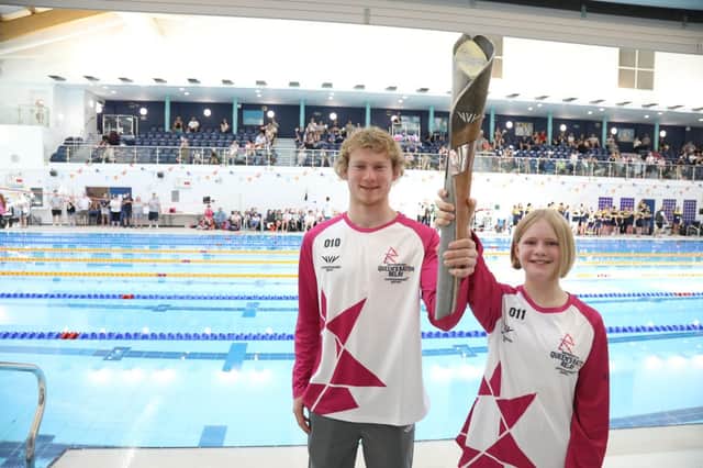 Archie Evans and Rebecca Johnson with the baton