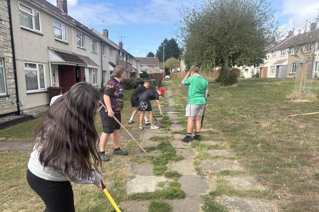 Young volunteers from S&L Rugby Club helping out at Selby Walk on Corby's Beanfield estate. Image: NW