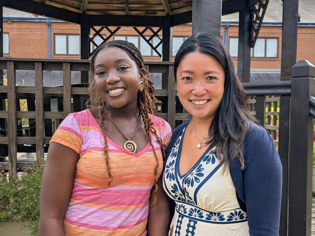 Northampton High School student, Aiyven, smiles proudly with Dr Lee after receiving her GCSE results