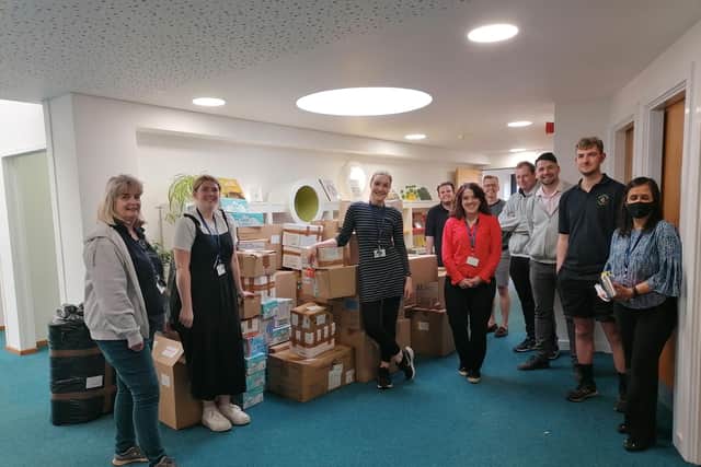 School staff ready to load the items.