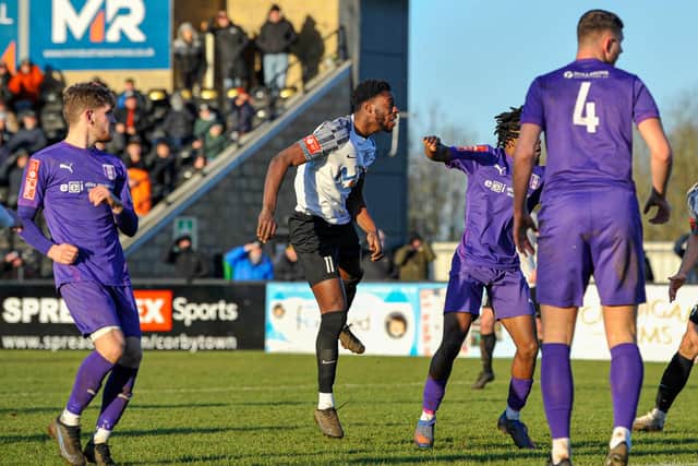 Hilton Arthur heads home Corby's second goal