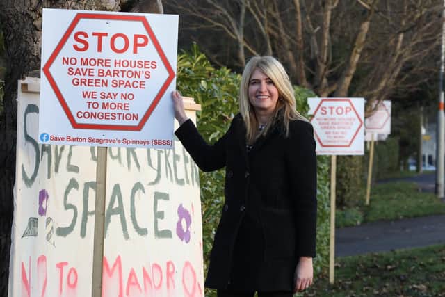 Tina Murphy with some of the signs in Barton Road, Barton Seagrave/National World