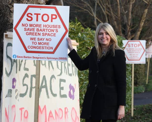 Tina Murphy with some of the signs in Barton Road, Barton Seagrave/National World