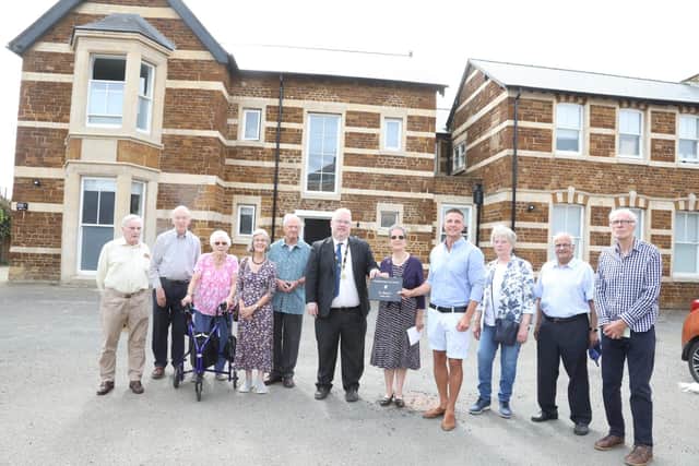 Members of Wellingborough Civic Society with, in centre, Cllr Jon-Paul Carr deputy mayor of Wellingborough, Judith Thompson (Wellingborough Civic Society) and Stefan Gavin (Vantage Homes)
