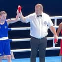 Lauren Mackie gets her arm raised after she sealed a first-round stoppage in the last 16 of the World Youth Championships