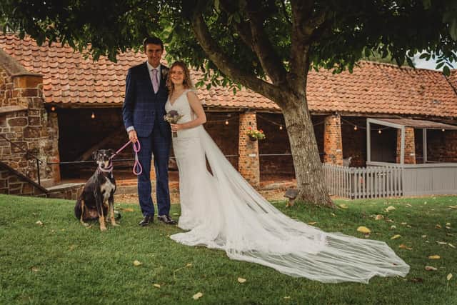 Callum, Jess and their pooch Maddie. Photo: 1st Class Photography.