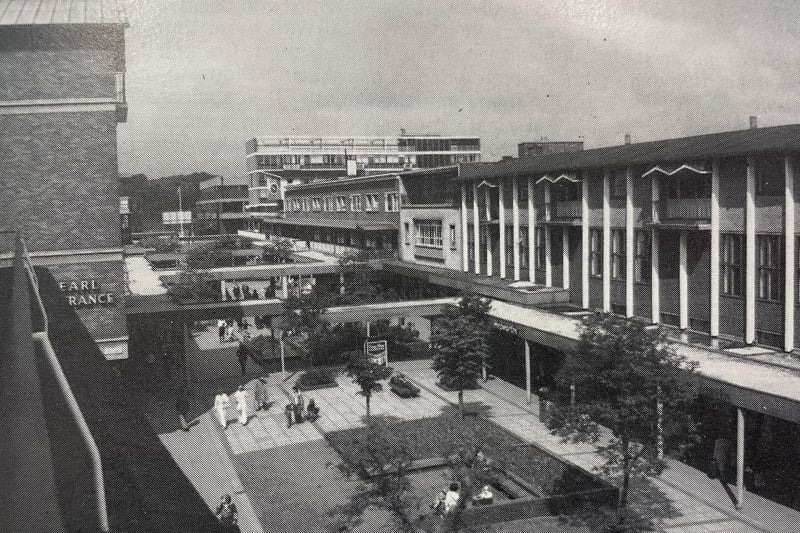 It's thought this image dates from around 1984 when the centre still had its covered walkways. The image is taken from the balcony of the old council offices.