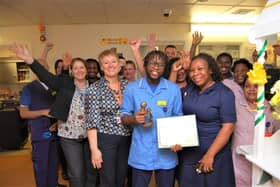 Ayomide Owolabi with his DAISY Award congratulated by the Naseby team.