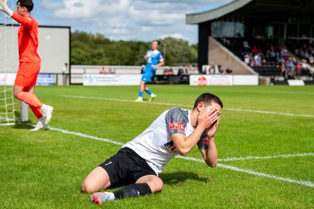Jordan O'Brien reacts after a missed chance in Corby's loss to Lowestoft