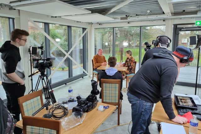 Oliver Budd with Victoria Wicks filming in Cornerstone - Kettering art gallery and library