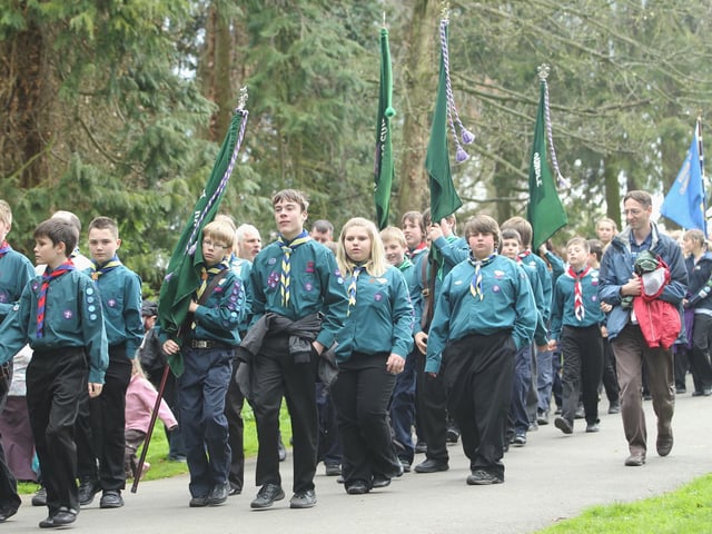 Scouts, Guides and Brownies parade through Hall Park in Rushden to celebrate St George's Day. 2012
