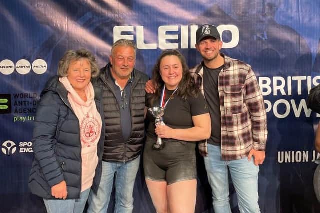 Harriet Waite collecting her British Junior Championship trophy with mum Julia, dad Kevin and brother Sam
