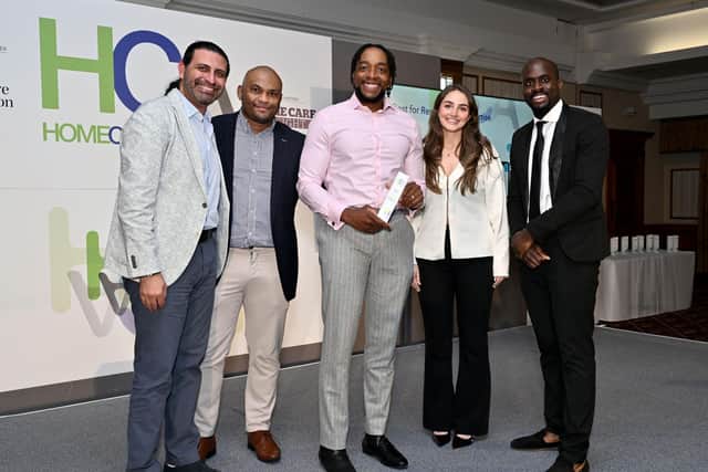 Director Winner Lawal of Mega Nursing & Care pictured with the Northamptonshire team as they collect their award.