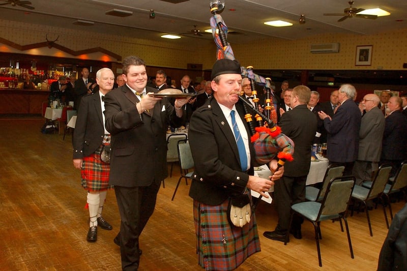 The haggis being piped in to Corby's Grampian club in 2003 by piper Michael Murray.