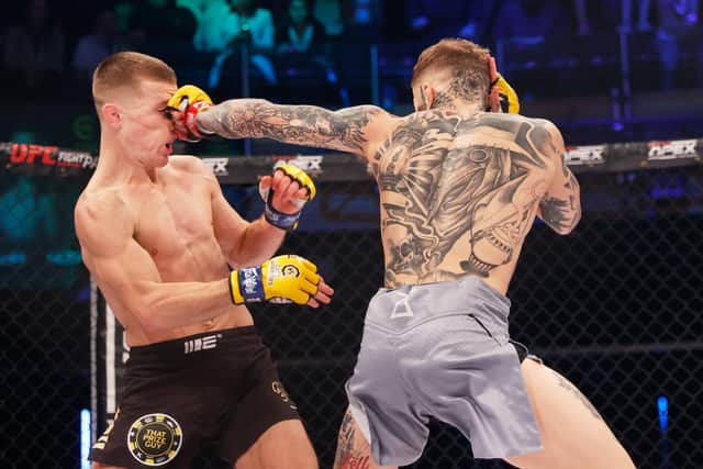 Jordan Vucenic lands a punch on Paul Hughes