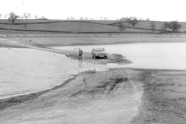 The reservoir that had been built 20 years before dried up enough that cars could use previously submerged roads