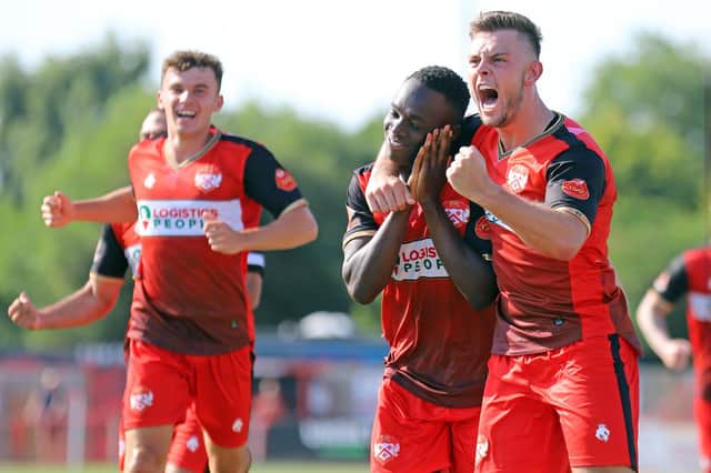 Andrew Oluwabori celebrates with Ben Toseland after he put Kettering Town in front. Picture by Peter Short