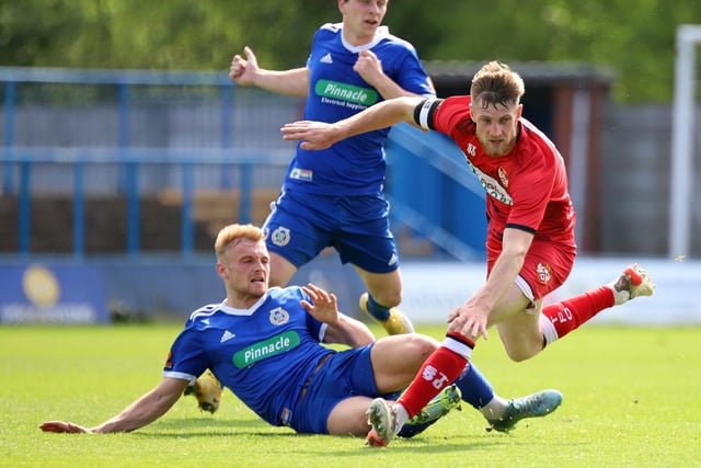 Poppies captain Connor Kennedy is challenged by a Curzon Ashton opponent
