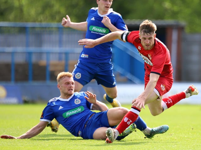 Poppies captain Connor Kennedy is challenged by a Curzon Ashton opponent