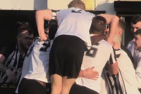 Jordan O'Brien is mobbed by his team-mates and the fans after he scored Corby Town's winner in last weekend's 2-1 victory over Carlton Town