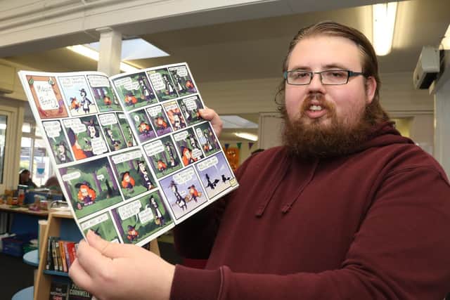 Max Champion with his comic strip
