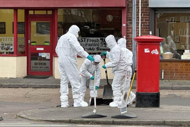 Police forensics officers in Occupation Road, Corby UGC