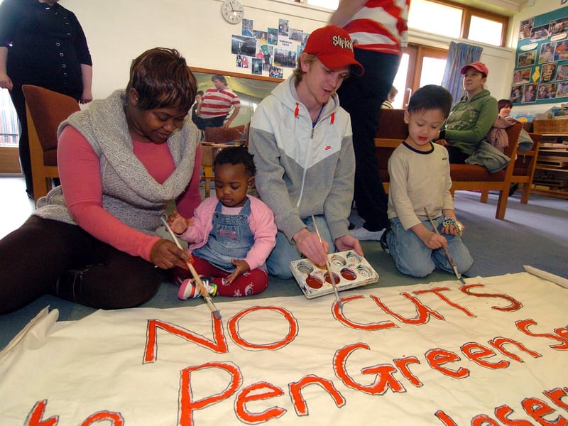 Parents ahead of the 2011 protest. Pictured are Tendayi Nyikavaranda with daughter Hannah Balogun, 1, and Mark McFadyen, with Josh Adams, 5.