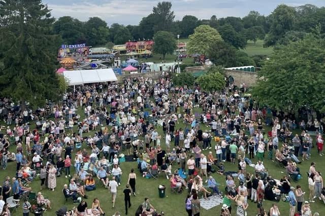 Crowds resist the rain and descend on Hall Park to enjoy the day.