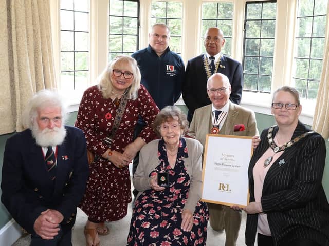 Megan Graham with her Gold British Legion award for more than 50 years service/National World