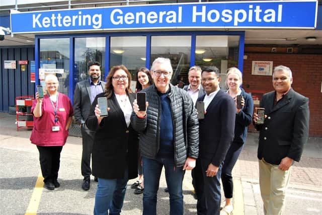 Some of the staff involved in the new App with patients Agnes Anderson and Colin Budden centre