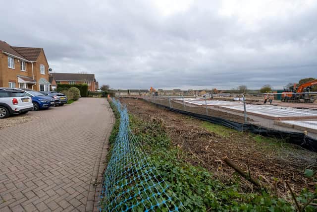 Jeanette Reid's view of the building site in Desborough, Northants, after housing developers removed her hedge