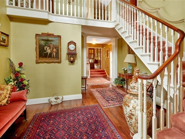 The home has traditional features as well as an indoor swimming pool, equestrian facilities and extensive parkland.