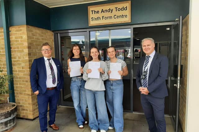 Mr S Anderson and Mr J Birkett with three of our top achievers.
