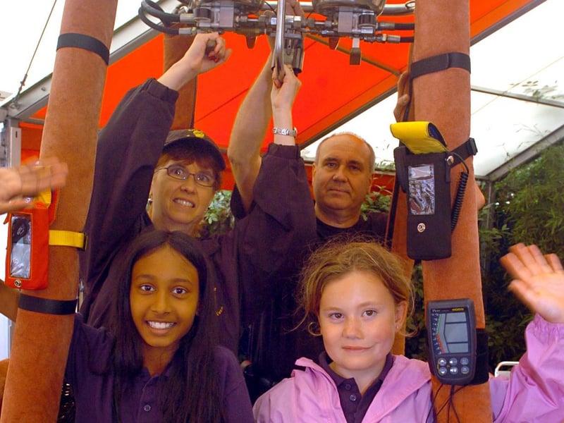 Beez Neez Balloon Team with their hot air ballon, alongside Dorothy Vinton and Richard Vinton, Macy Reddy, 10, and Billie Robinson, 10, from Oundle Middle School.