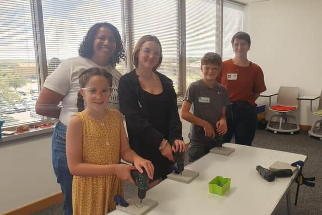 Drill art being demonstrated at RS to (left to right) Poppy Mills, nine, Brightbox’s Kisha Bradley, Phoebe Mullan, 13, Tyler Constable, 12, and Brightbox Freya Vanevey