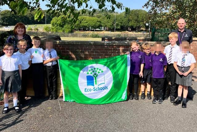 Pupils and staff at Hazel Leys Academy celebrating eco-schools award.