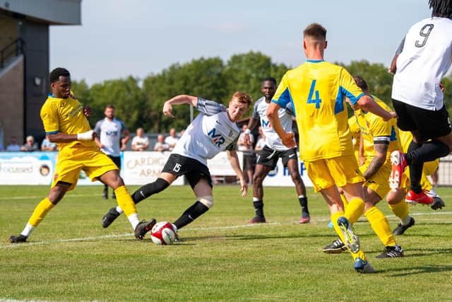 Dan Collins tries to get hold of the ball in the area for the Steelmen