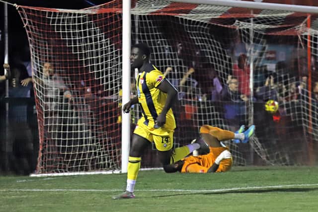 Michael Gyasi runs away to celebrate after netting Kettering's equaliser (Picture: Peter Short)