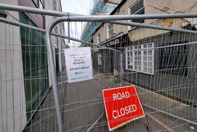The road next to the Prince of Wales pub has been closed to pedestrians and cars