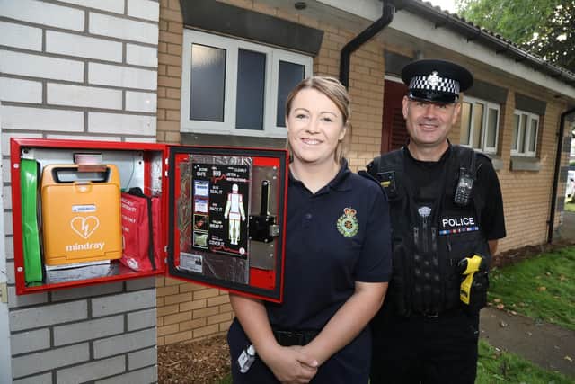 North Northants Community First Responder Stacey Price and  neighbourhood officer for Northants Police Vince Bangs with the new cabinet