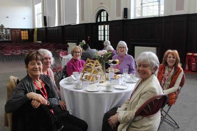 Former students enjoying afternoon tea in the great hall.