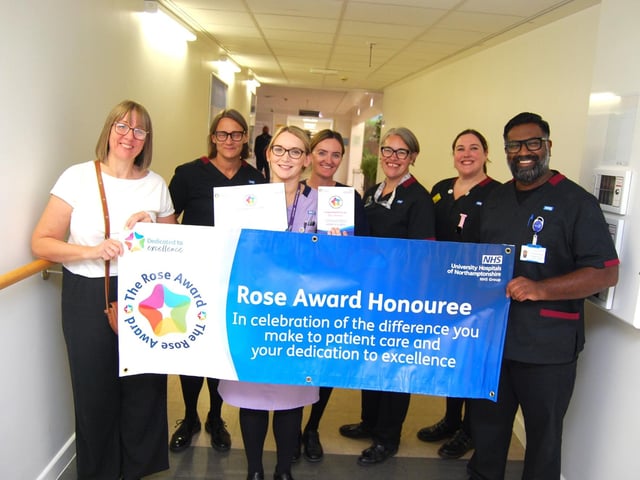 Ellie Silver with her colleagues and her award