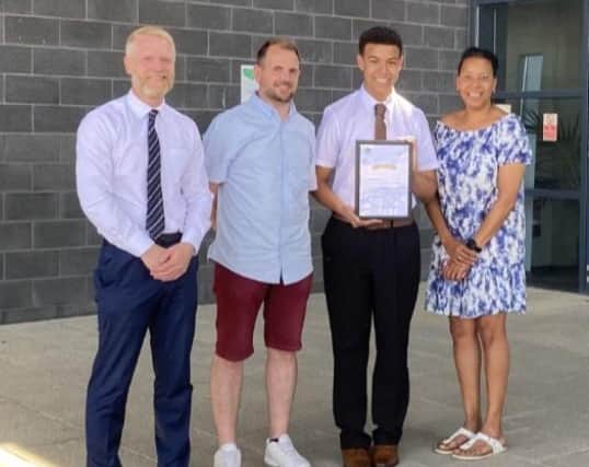 Reece Forsdikes with Corby Business Academy headteacher Simon Underwood and his mum and dad