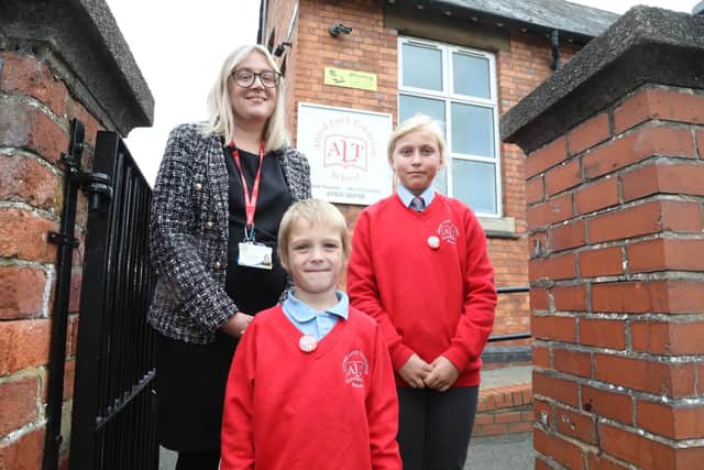 Mrs Kelly O'Connor, head teacher of Alfred Lord Tennyson School in Rushden with school council members Leo and Olivia