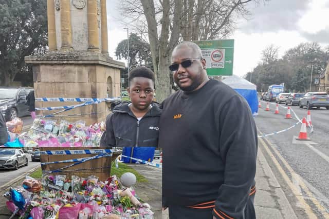 Prince, who was friend's with the victim, and his dad Nasha paid their respects at the war memorial in Harborough Road on Thursday (March 23)